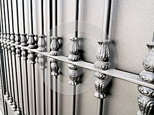 Iron fence over metal gate