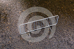 iron fence placed in the middle of a river like garbage spoiling the ecosystem and nature