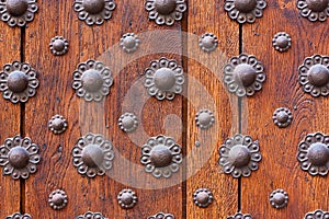 Iron flower pattern over wooden door