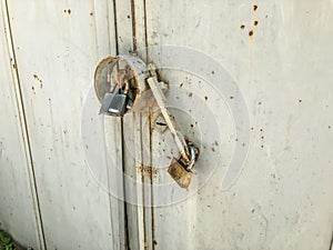 Iron garage doors. Rusty door. Door hinges. Close up shot