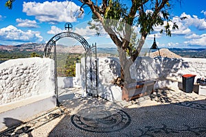 Iron gate and bronze bell in Tsambika Monastery, RHODES, GREECE