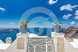 Iron gate idyllic white Santorini island view in Greece. Travel, tourism destination, luxury scenic