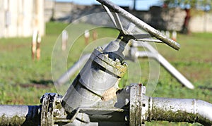 iron gate valve to close or open the natural gas flow from the w photo