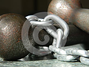 Iron gauntlets and chain on the floor