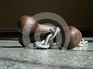 Iron gauntlets and chain is lying on the floor