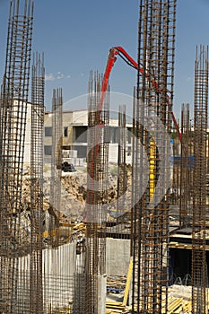 Iron grid for reinforcement of a building walls and foundation and concrete blocks at construction site.