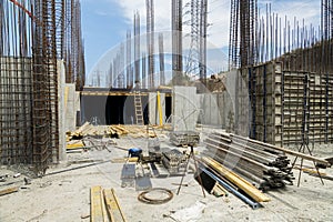 Iron grid for reinforcement of a building walls and foundation and concrete blocks at construction site.