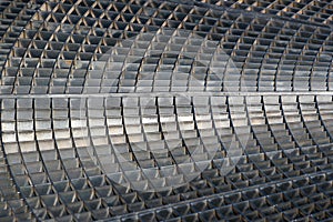 Iron gutter grates and metal vent grids as background