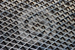 Iron gutter grates and metal vent grids as background