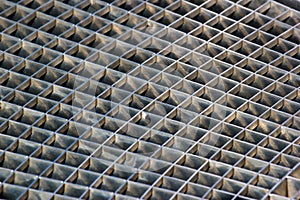 Iron gutter grates and metal vent grids as background