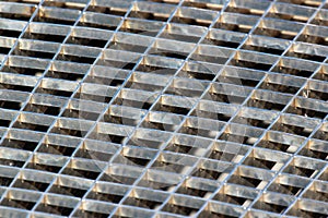 Iron gutter grates and metal vent grids as background