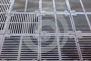 Iron gutter grates and metal vent grids. industrial background.