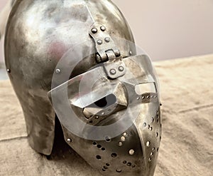 Iron helmet with visor protection of medieval warrior in war