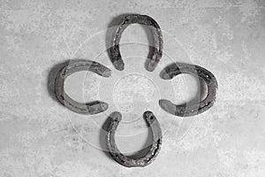 Iron horseshoes on concrete background