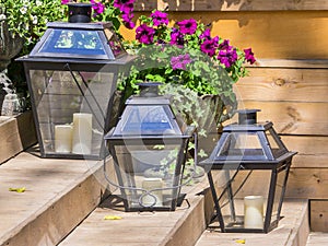 Iron lamps for candles and flowers petunias
