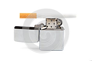 Iron lighter and cigarette on white