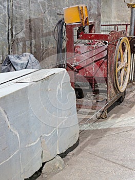 Iron Machinery for the Extraction and Cutting of Marble Slabs inside a Quarry in Carrara, Tuscany, Italy