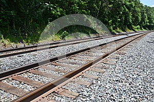 Iron metal railroad train tracks with stones