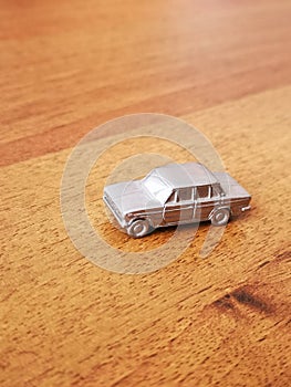 Iron mini model retro car on the wooden texture