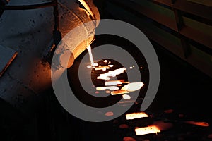 Iron molten metal pouring in sand mold ;