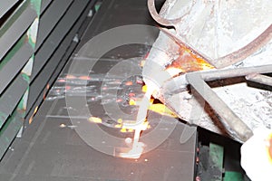 Iron molten metal pouring in sand mold