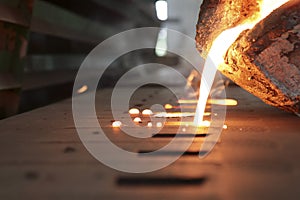 Iron molten metal pouring in sand mold