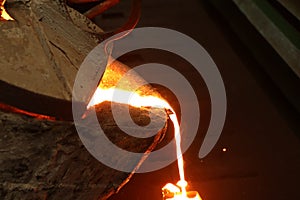 Iron molten metal pouring in sand mold