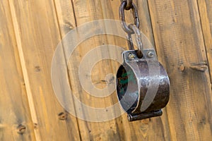 Iron old chains with a chain of chained slaves and criminals mediaeval 1600 1800 handcuffs on a wooden background