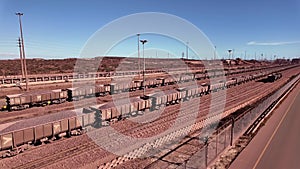 Iron ore carrying railway wagons arriving at Saldanha South Africa.