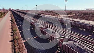 Iron ore carrying railway wagons arriving at Saldanha South Africa.