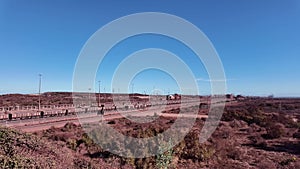 Iron ore filed railway wagons arriving at Saldanha Bay South Africa