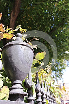 Iron railings bordering a London garden square in Autumn photo