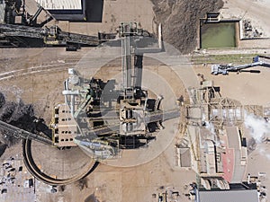 Iron raw materials recycling pile, work machines. Metal waste junkyard. View from above.