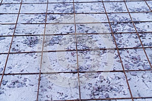 Iron reinforcement lying on the floor prepared for bonding and reinforcement before pouring concrete