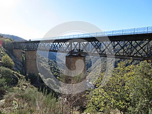 Iron road bridges metal rail light at the end of the tunnel train transport photo