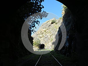 Iron road bridges metal rail light at the end of the tunnel train transport photo