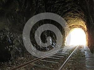 iron road bridges metal rail light at the end of the tunnel train transport photo