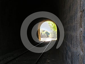 iron road bridges metal rail light at the end of the tunnel train transport photo