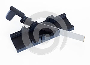 An iron saw and a miter box.