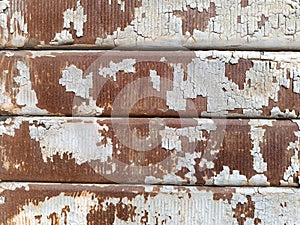 Iron shutter with white paint peeling off from rust, grunge effect