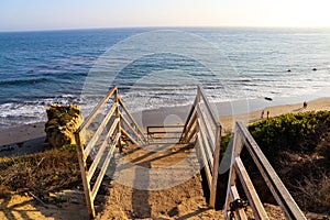 An iron staircase leading down the beach over looking the deep blue ocean and the beach at El Matador beach