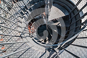 Iron stairs on the top of elevator Santa Justa in Lisbon. Vintage black steel spiral staircase