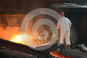 Iron and steel factory worker in the work