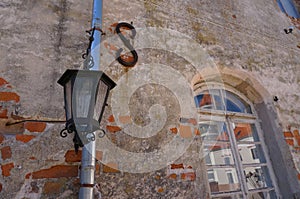 Iron Street Lantern.Old wall background. Lantern and window.