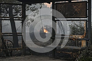 Iron structure damaged by fire from forest fire