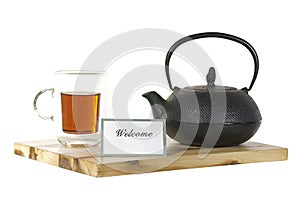 Iron tea pot, teaglass, tea and welcome photo
