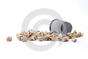 Iron trash bin full of paper, isolated on white background