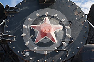 Iron wheels of mighty steam locomotives, red iron wheels of steam locomotives, steel wheels of a steam locomotive, steel power of