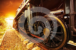 Iron wheels of stream engine locomotive train on railways track