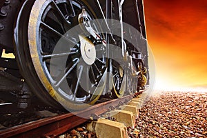 Iron wheels of stream engine locomotive train on railways track photo